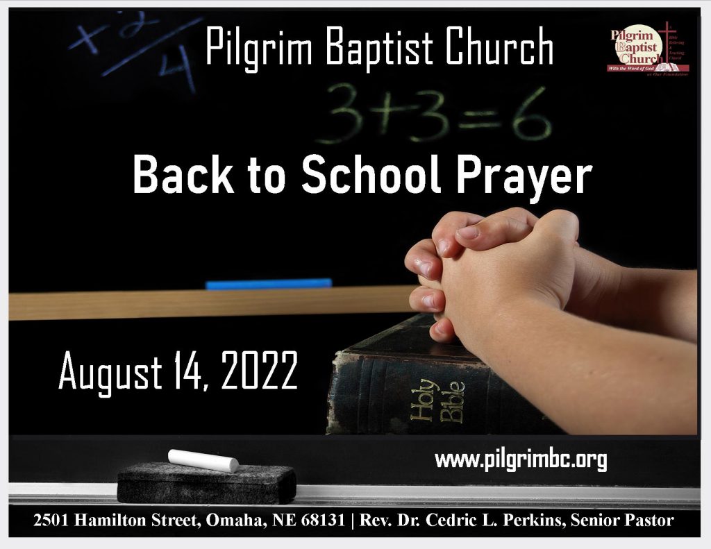 Back to School Prayer on a chalkboard with hands of a child folded in prayer on top of a Bible.