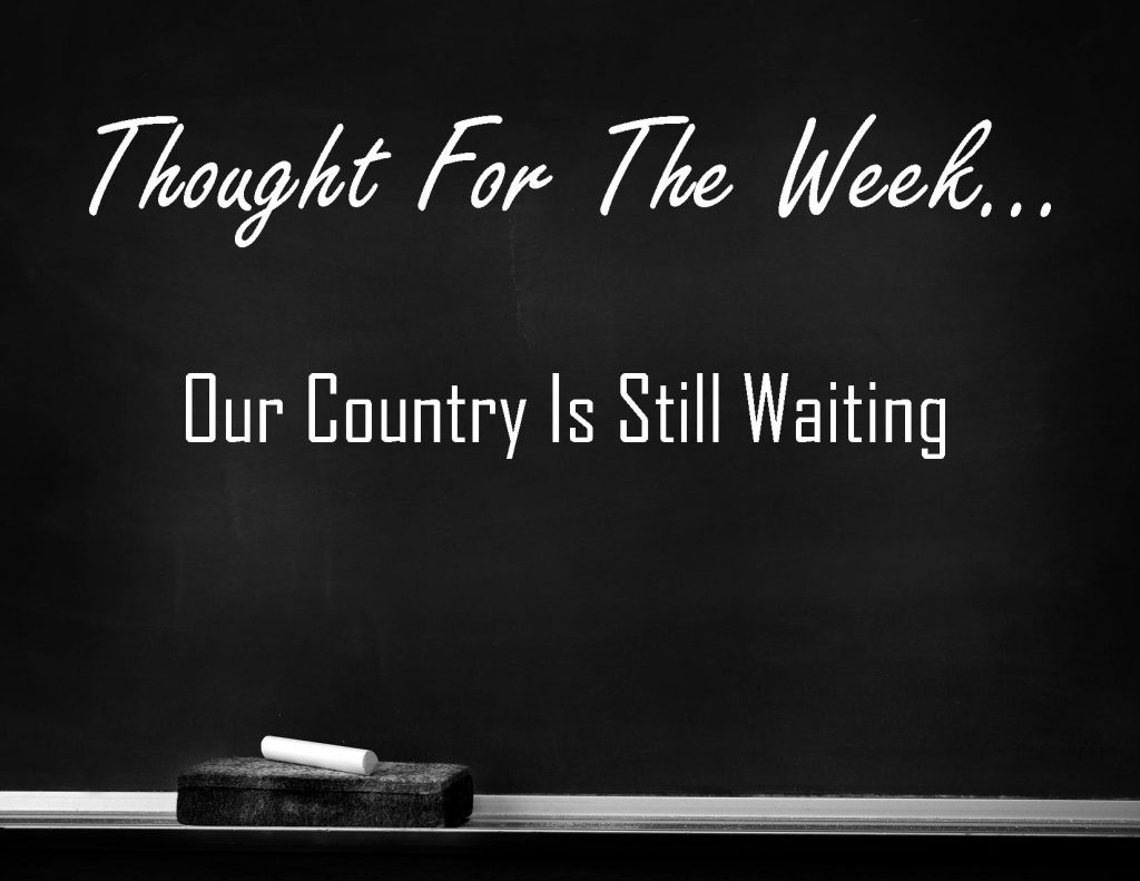 Our County Is Still Waiting is the Thought for the Week written in chalk on a black chalkboard.